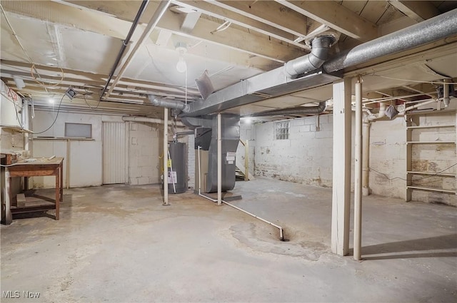 basement with heating unit and water heater