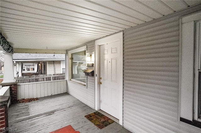 doorway to property featuring covered porch