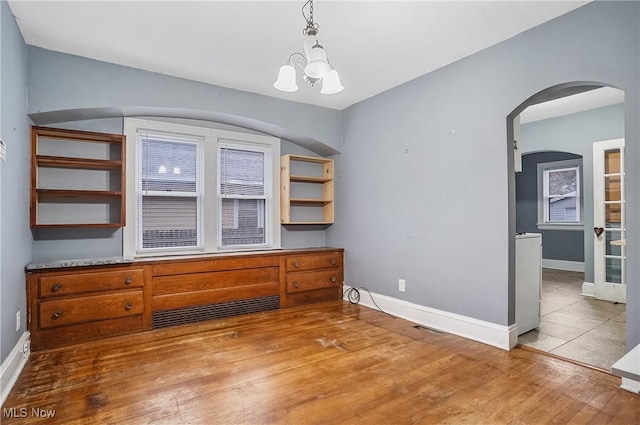 interior space with hardwood / wood-style floors and a chandelier