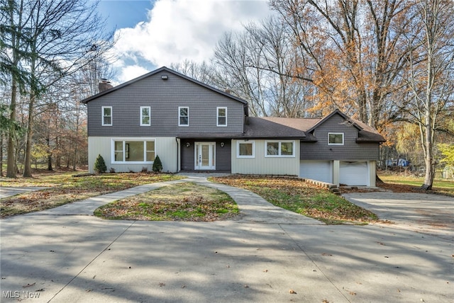 front of property with a garage