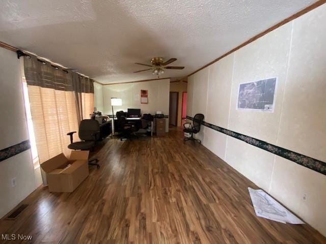 home office featuring wood-type flooring, a textured ceiling, ceiling fan, and ornamental molding