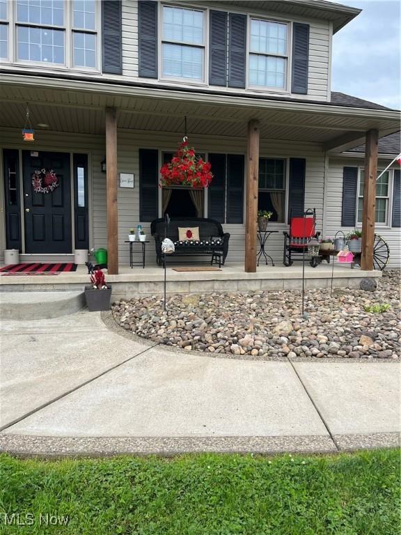 entrance to property with a porch