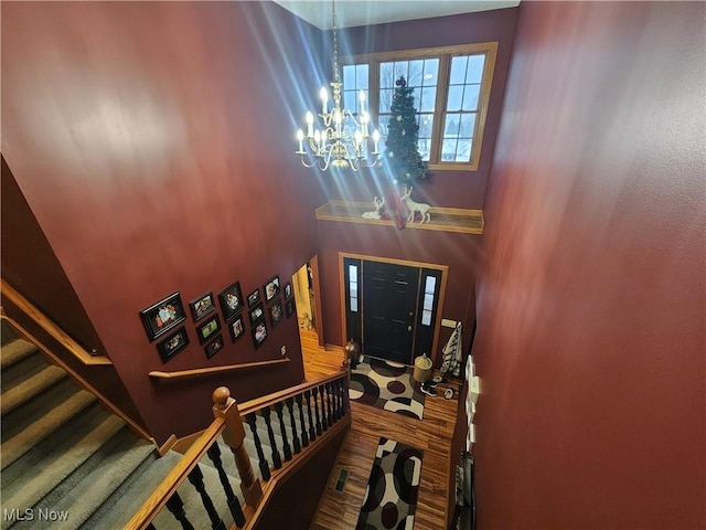 entryway with a chandelier and hardwood / wood-style floors