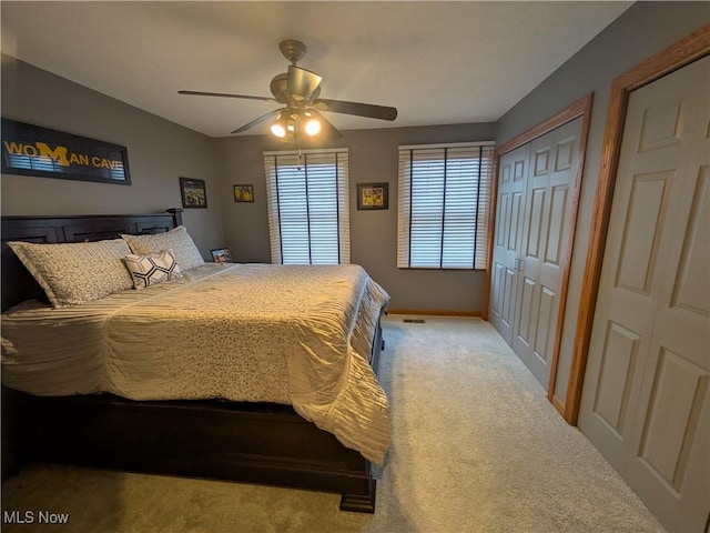 carpeted bedroom with ceiling fan