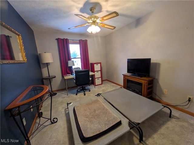 office area with carpet floors and ceiling fan