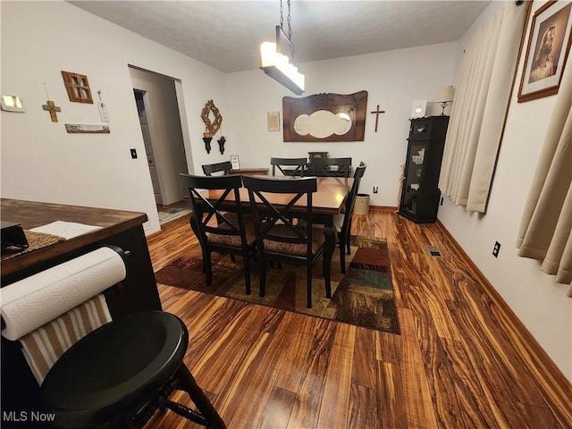 dining space featuring hardwood / wood-style floors