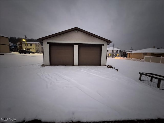 view of snow covered garage