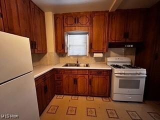 kitchen with sink and white appliances