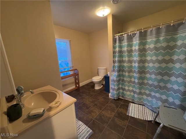 bathroom with tile patterned flooring, vanity, toilet, and a shower with curtain