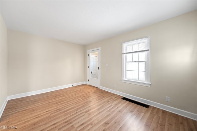 empty room with light wood-type flooring