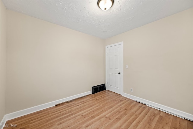 empty room featuring light hardwood / wood-style floors