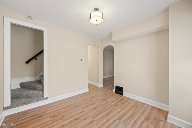 empty room with light hardwood / wood-style flooring