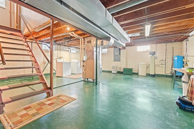 basement with separate washer and dryer and electric panel