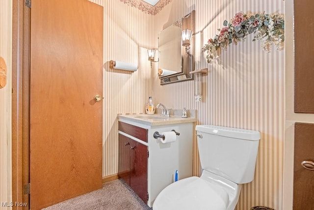 bathroom with toilet and vanity