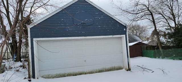 view of snow covered garage