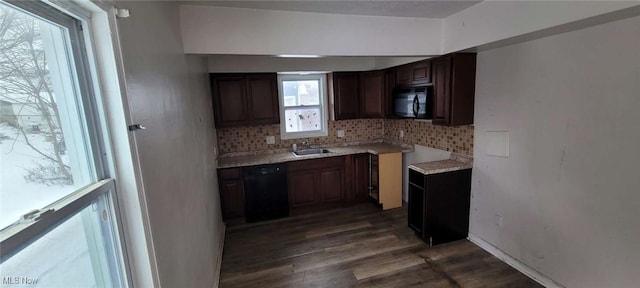 kitchen with decorative backsplash, dark hardwood / wood-style flooring, sink, and black appliances