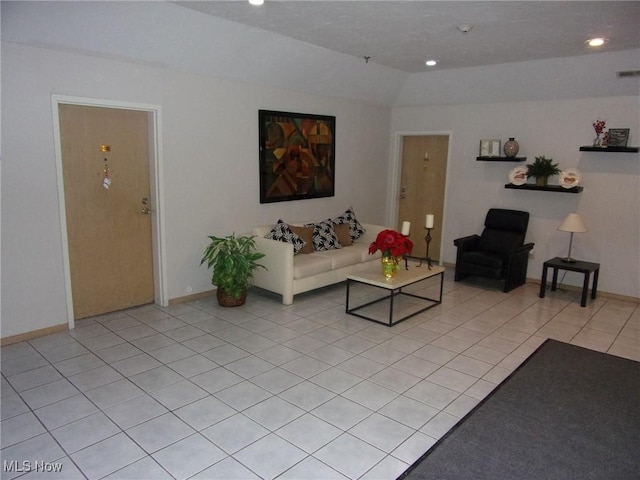 unfurnished living room with light tile patterned floors and vaulted ceiling