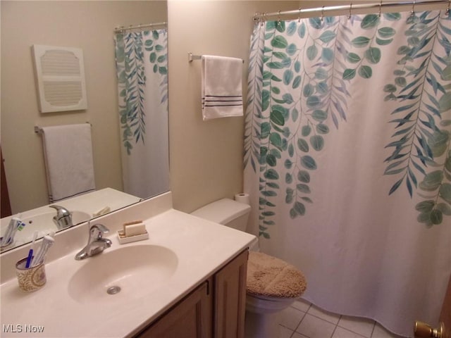 bathroom with tile patterned flooring, vanity, curtained shower, and toilet