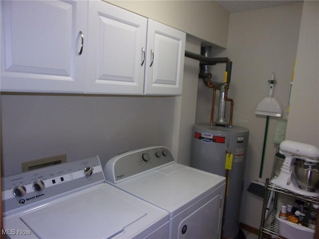 laundry area featuring water heater, cabinets, and independent washer and dryer