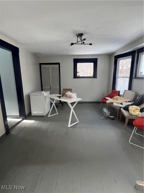 living area with a healthy amount of sunlight and hardwood / wood-style floors