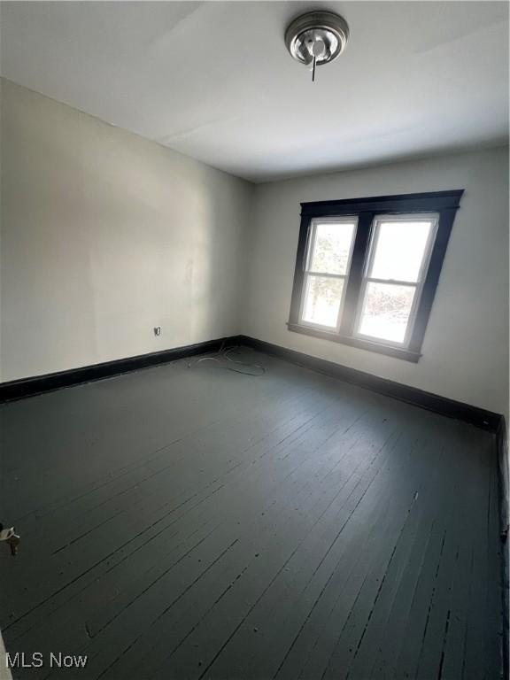 spare room featuring hardwood / wood-style flooring