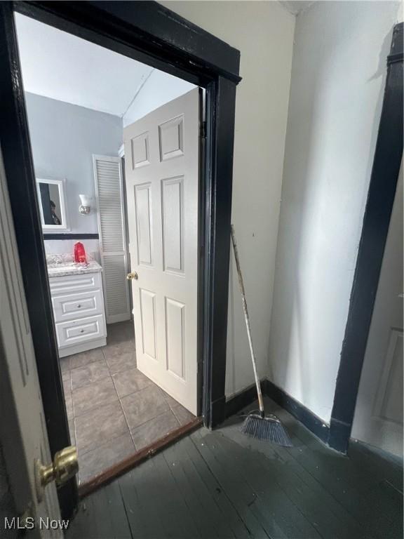 bathroom with hardwood / wood-style flooring