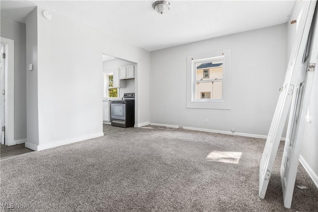 unfurnished living room featuring carpet