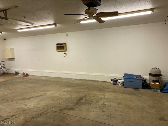 garage with ceiling fan and an AC wall unit