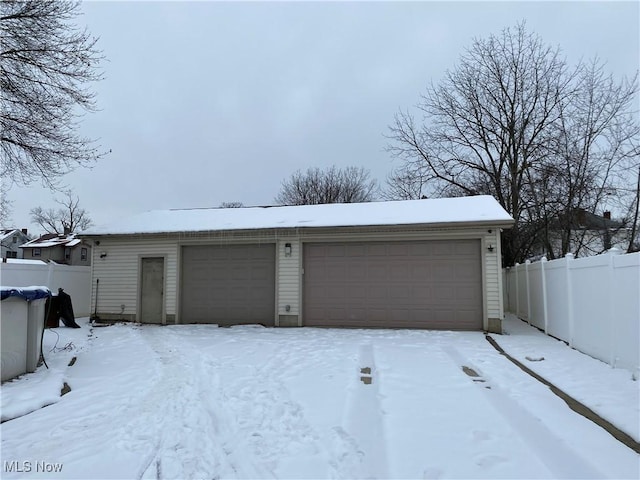 view of snow covered garage