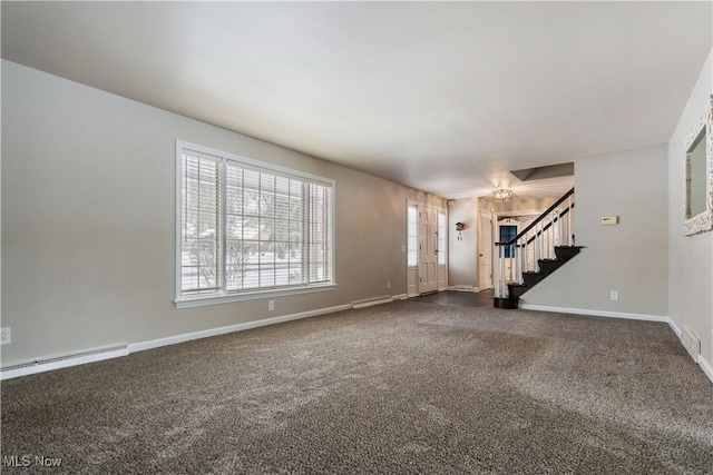 unfurnished living room featuring carpet and a baseboard heating unit