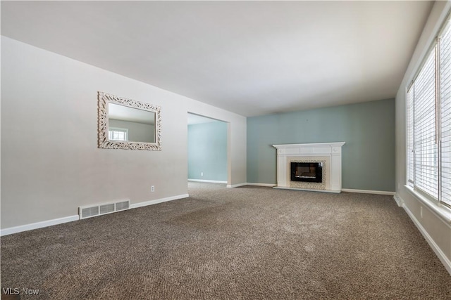 unfurnished living room featuring carpet floors