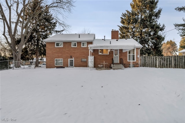 view of snow covered property