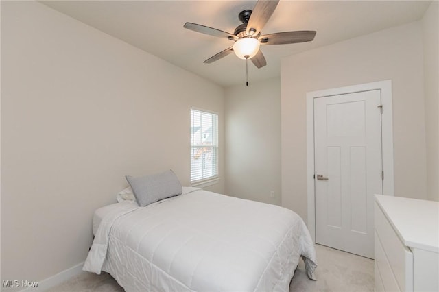 bedroom with light colored carpet and ceiling fan