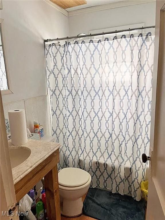 bathroom with vanity, curtained shower, toilet, and ornamental molding