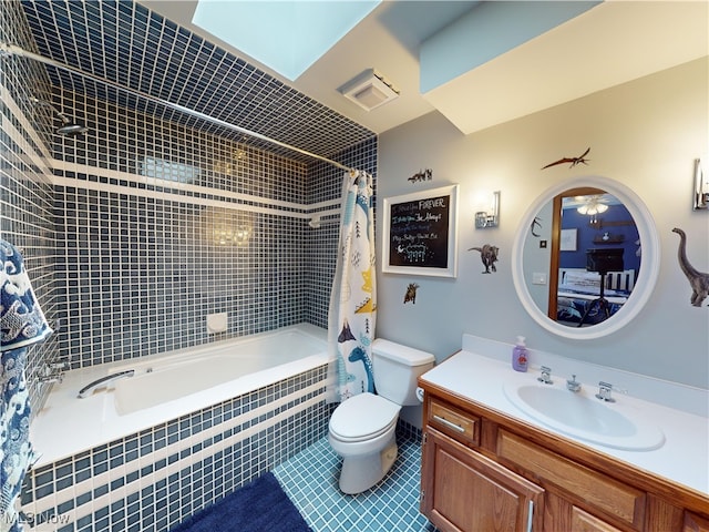 full bathroom featuring tile patterned floors, vanity, shower / tub combo, and toilet