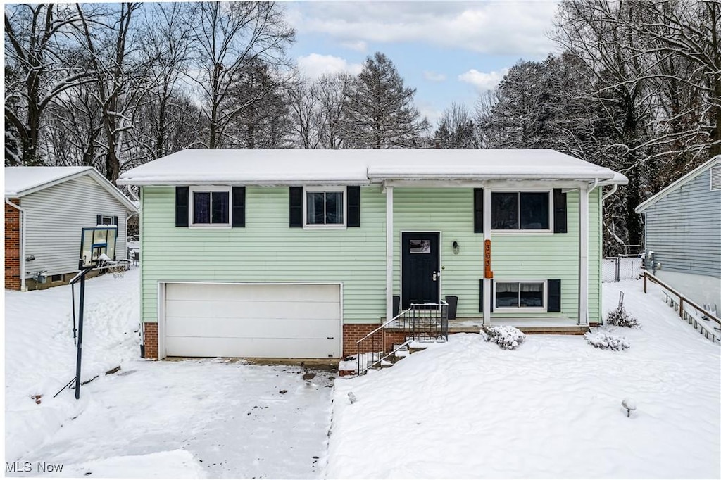 split foyer home featuring a garage