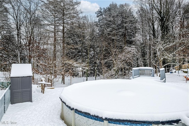 view of yard layered in snow