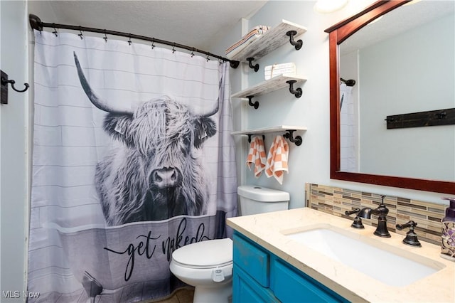 bathroom featuring tasteful backsplash, a shower with curtain, a textured ceiling, toilet, and vanity