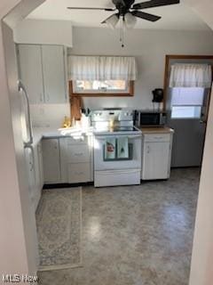 kitchen with white range with electric cooktop, ceiling fan, and white cabinets