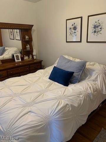 bedroom featuring wood-type flooring