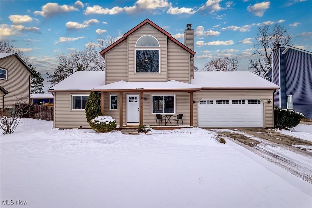 view of front of house featuring covered porch and a garage