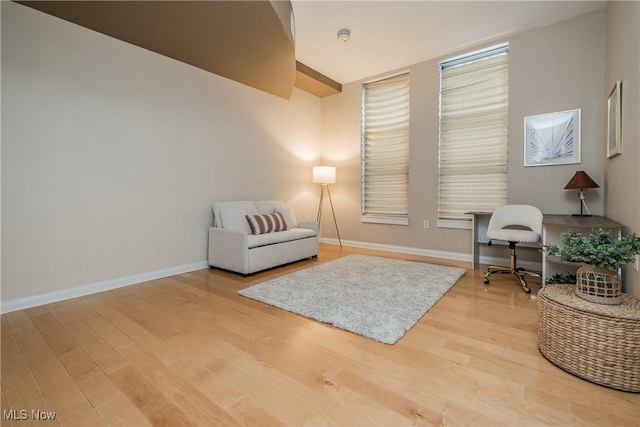 sitting room with hardwood / wood-style floors