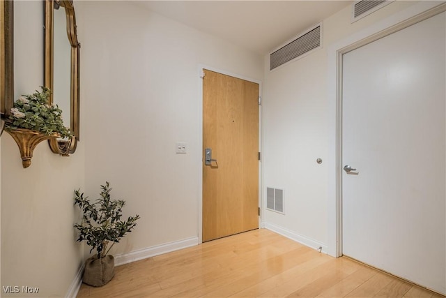 hallway featuring wood-type flooring