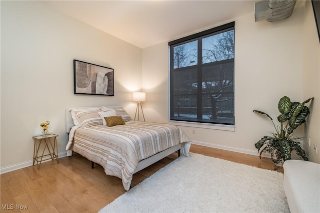 bedroom featuring hardwood / wood-style flooring