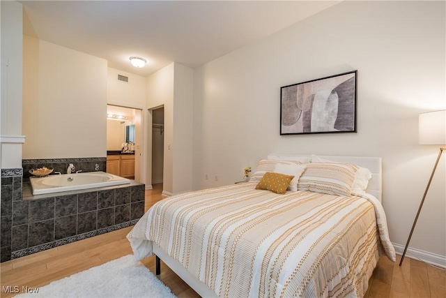 bedroom featuring light hardwood / wood-style flooring