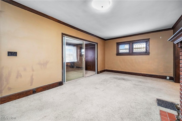 unfurnished bedroom with carpet flooring, ornamental molding, and a closet