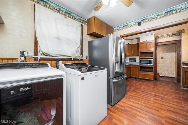 clothes washing area with dark hardwood / wood-style flooring, separate washer and dryer, and ceiling fan