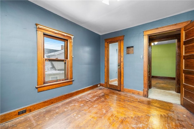 empty room featuring hardwood / wood-style flooring