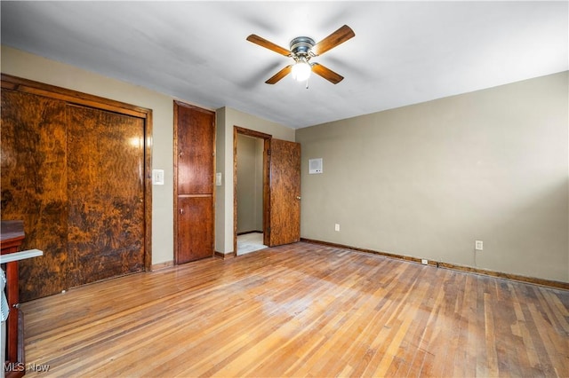 unfurnished bedroom featuring ceiling fan and light hardwood / wood-style flooring