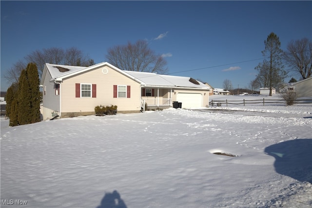 view of front facade featuring a porch and a garage